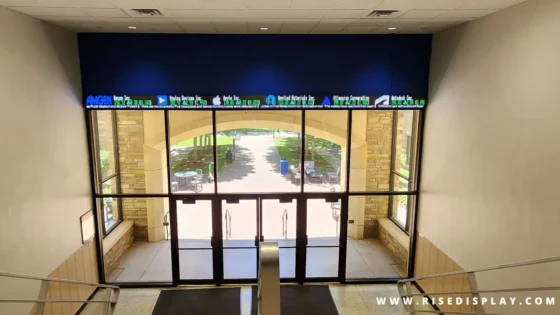 A Rise Display LED ticker above the Tulsa University entrance.